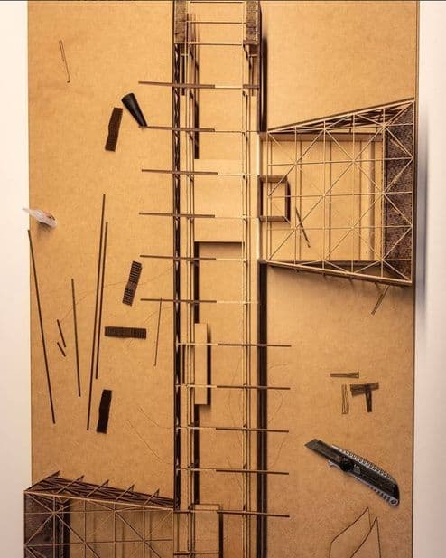 Vista superior da maquete Huallanco sobre chapa de MDF com peças soltas